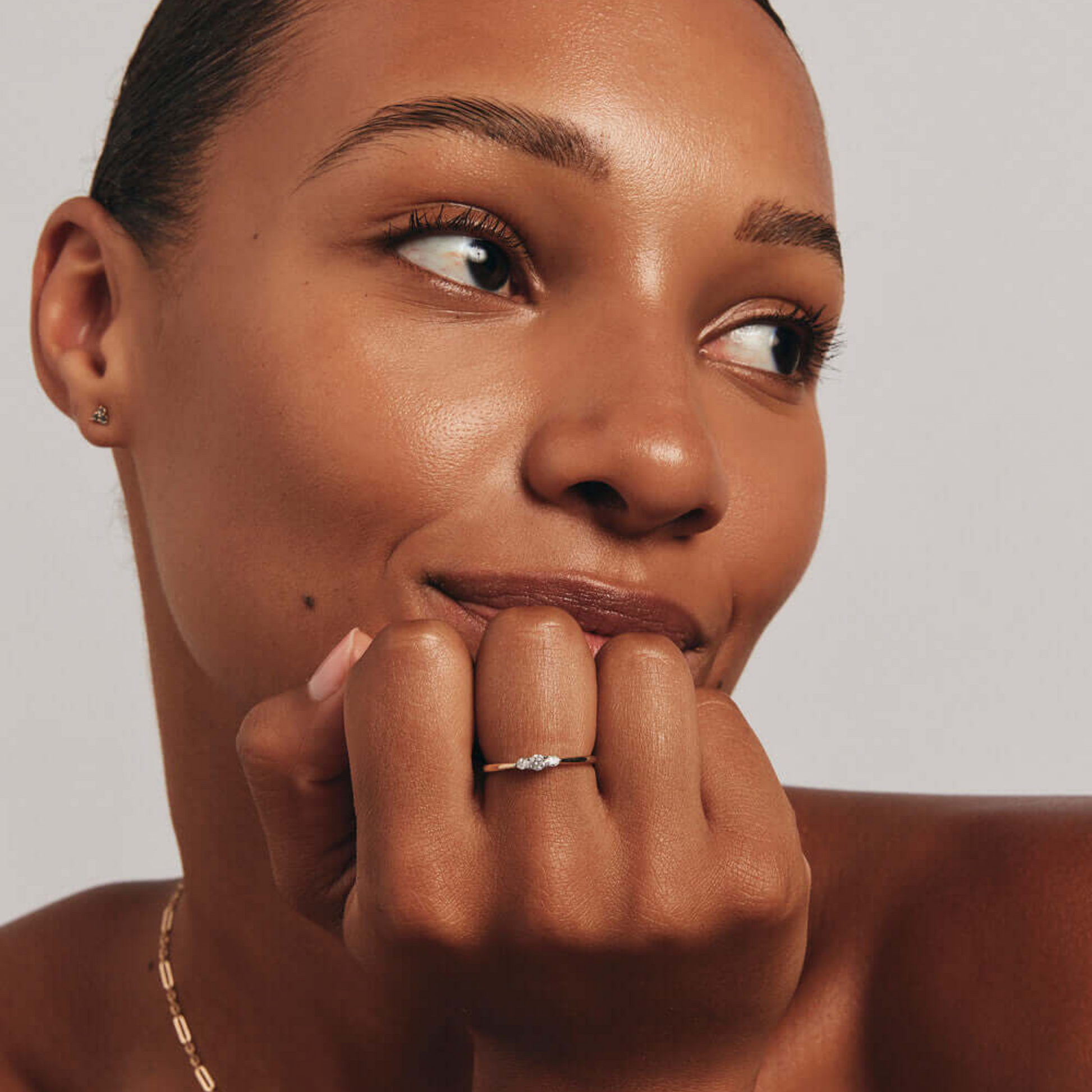 0.15 Carat TW Three Stone Round Brilliant and Oval Cut Diamond Promise Ring in 14kt Yellow and White Gold