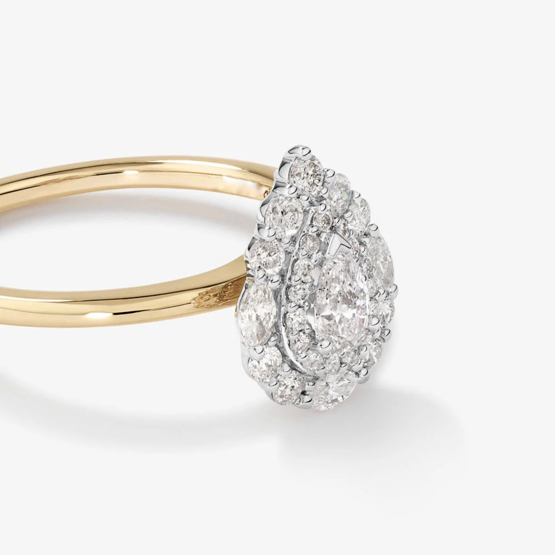 0.67 Carat TW Pear Cut Diamond Marquise and Round Brilliant Halo Engagement Ring in 14kt Yellow and White Gold