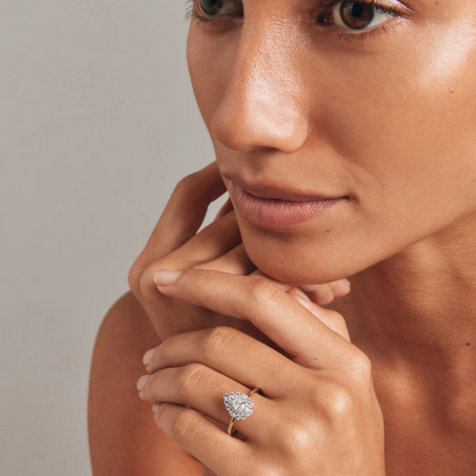 0.67 Carat TW Pear Cut Diamond Marquise and Round Brilliant Halo Engagement Ring in 14kt Yellow and White Gold