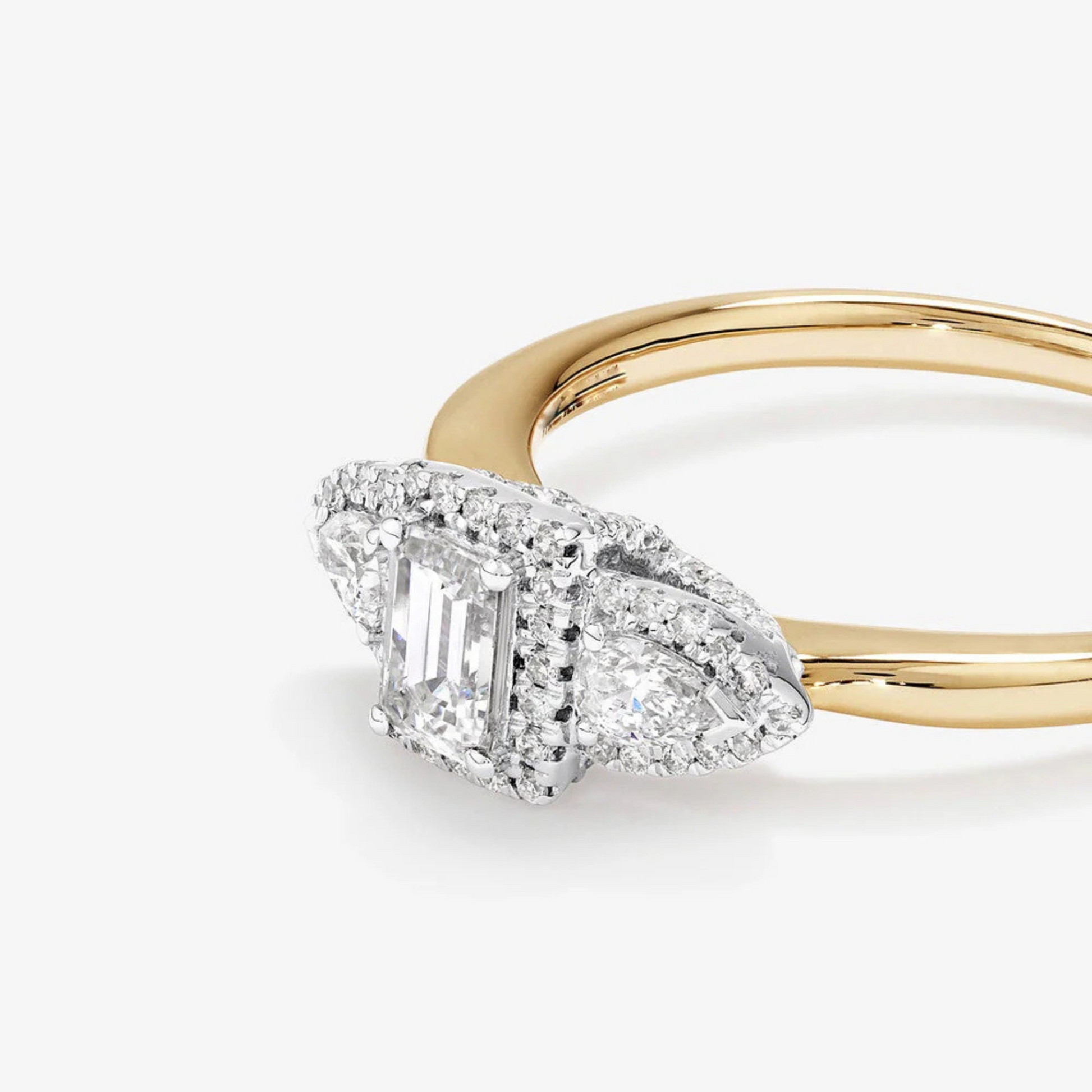 0.69 Carat TW Three Stone Emerald and Pear Cut Diamond Halo Engagement Ring in 14kt Yellow and White Gold