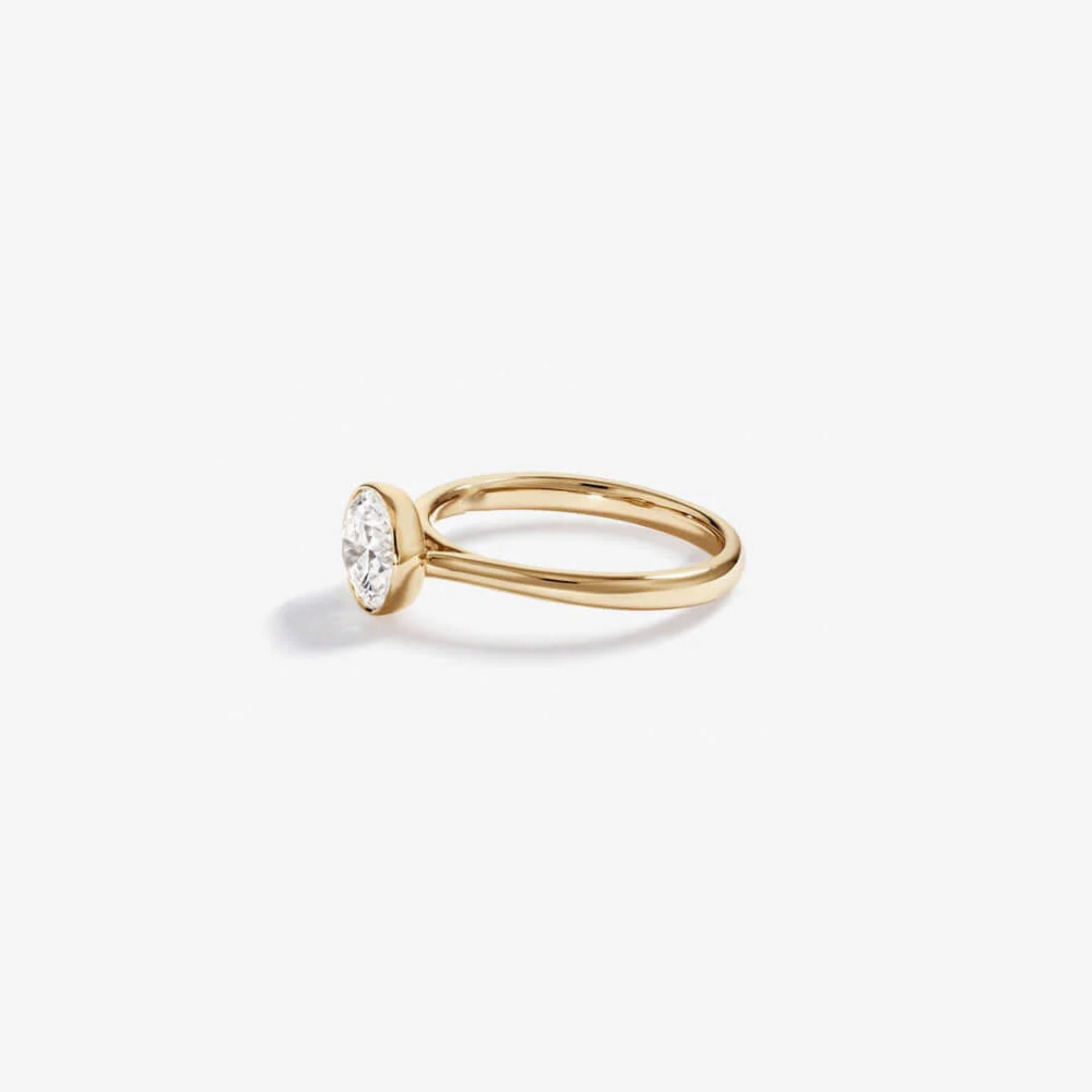 1.25 Carat TW Round Brilliant Laboratory-Grown Diamond Solitaire Bezel Set Engagement Ring in 14kt Yellow Gold