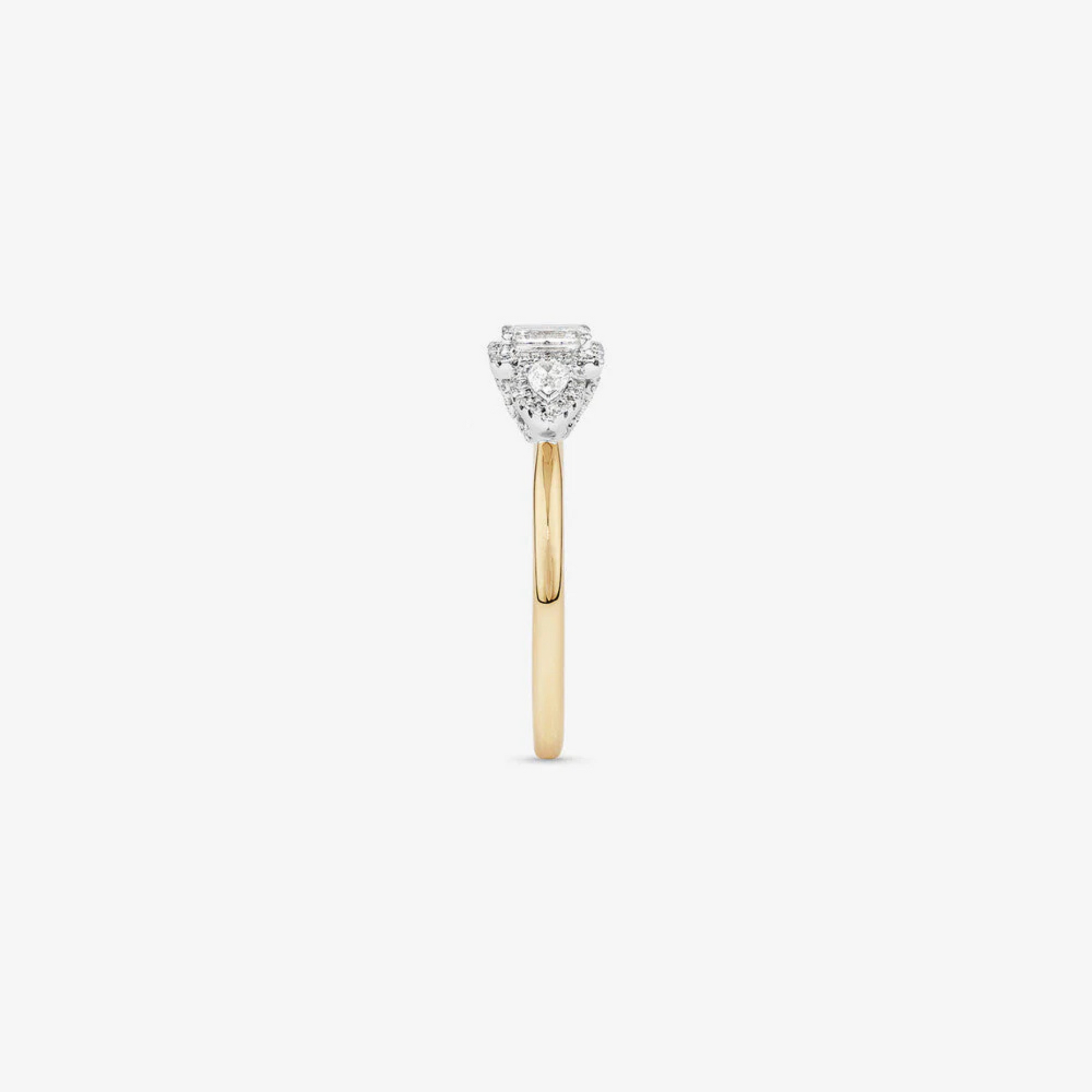 0.69 Carat TW Three Stone Emerald and Pear Cut Diamond Halo Engagement Ring in 14kt Yellow and White Gold